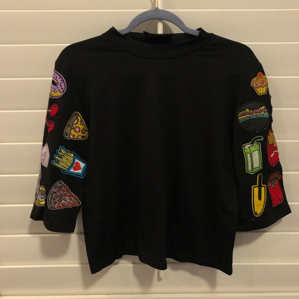 tee with patches on sleeves